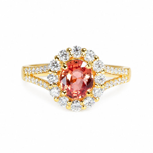 Padparadscha sapphire and diamond halo ring in 18K gold