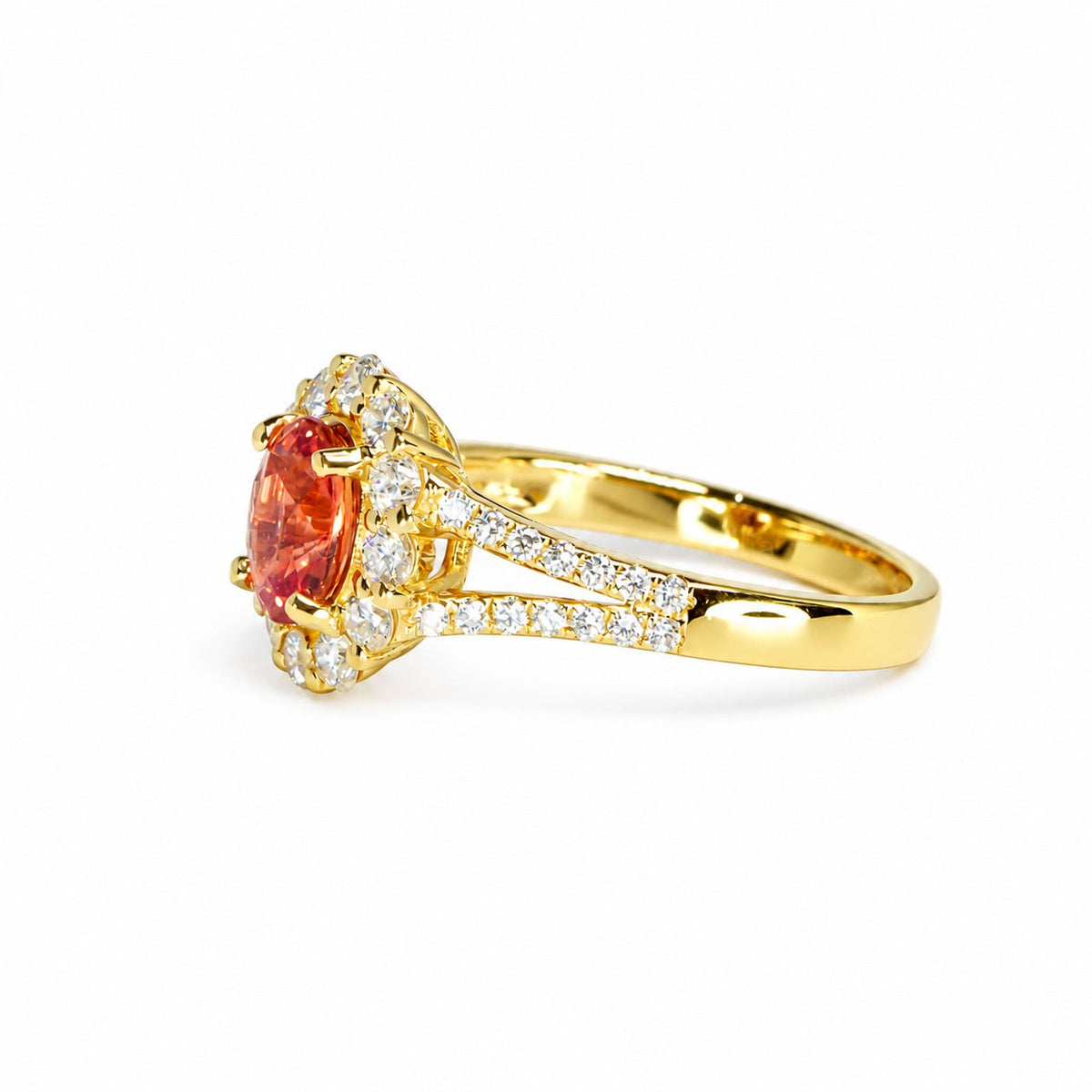 Side profile of the padparadscha ring showing its split pave shoulders