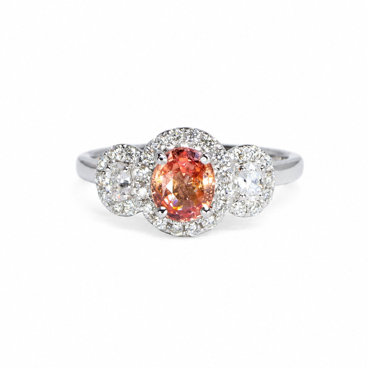 Padparadscha sapphire three stone halo ring in white gold