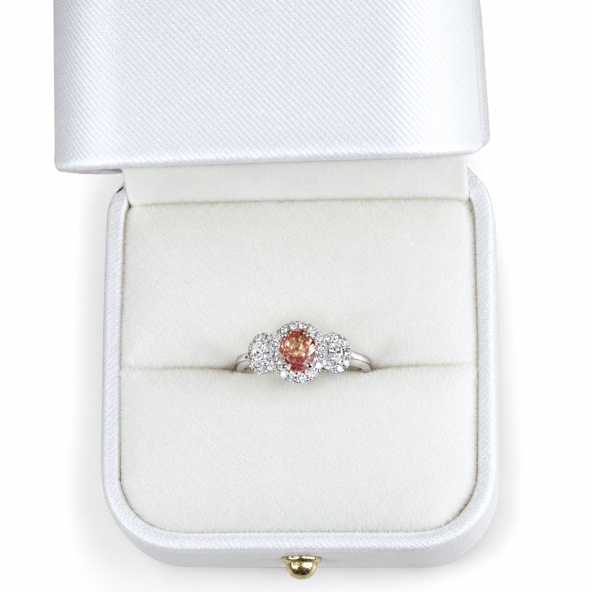 Padparadscha sapphire ring presented in its white gift box