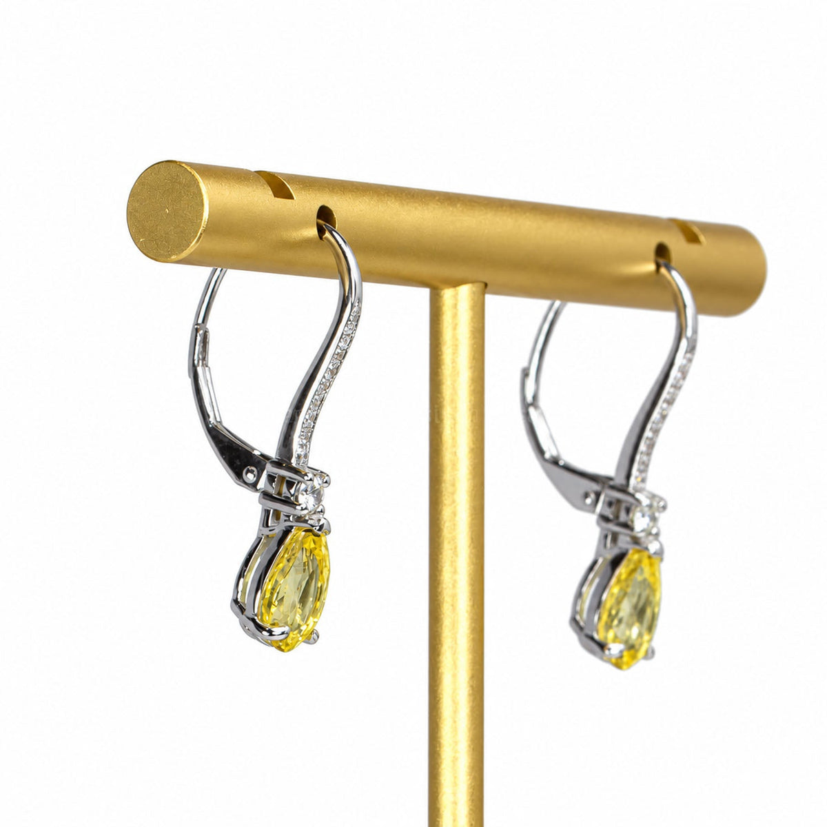 Yellow sapphire drop earrings shown from the side with their lever backs