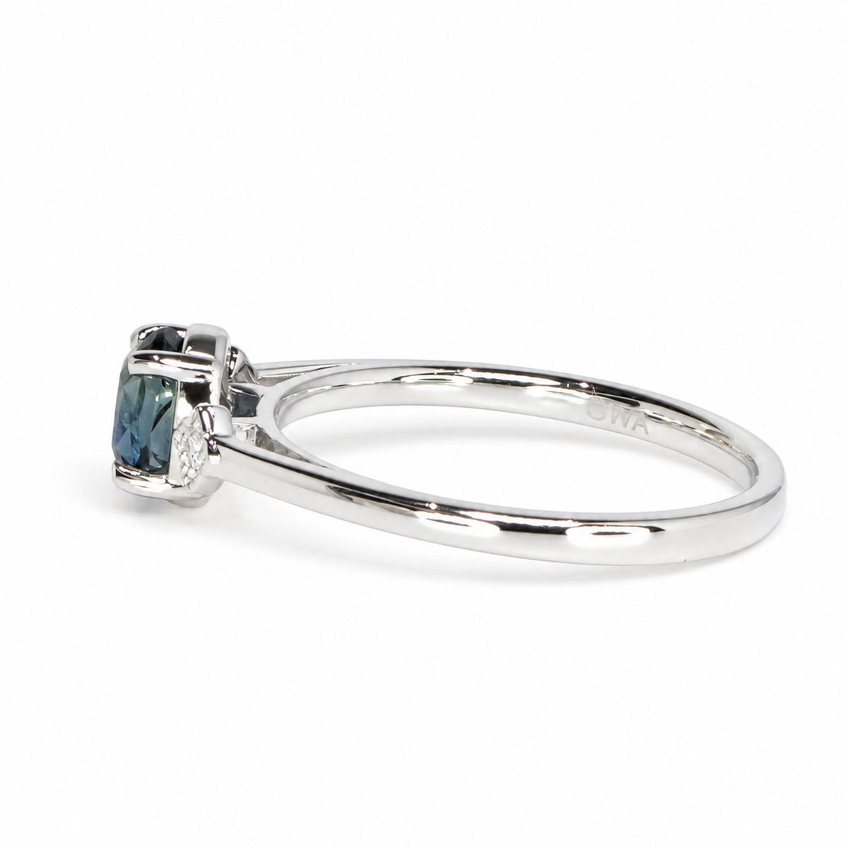 Side profile of the teal sapphire ring in white gold
