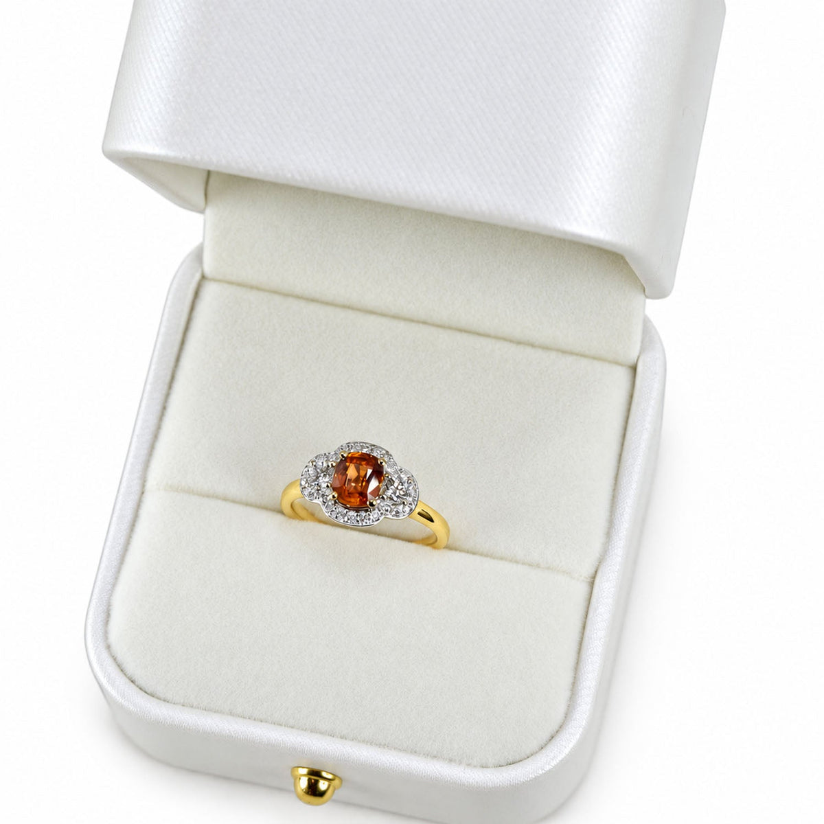 Padparadscha sapphire ring presented in its white gift box