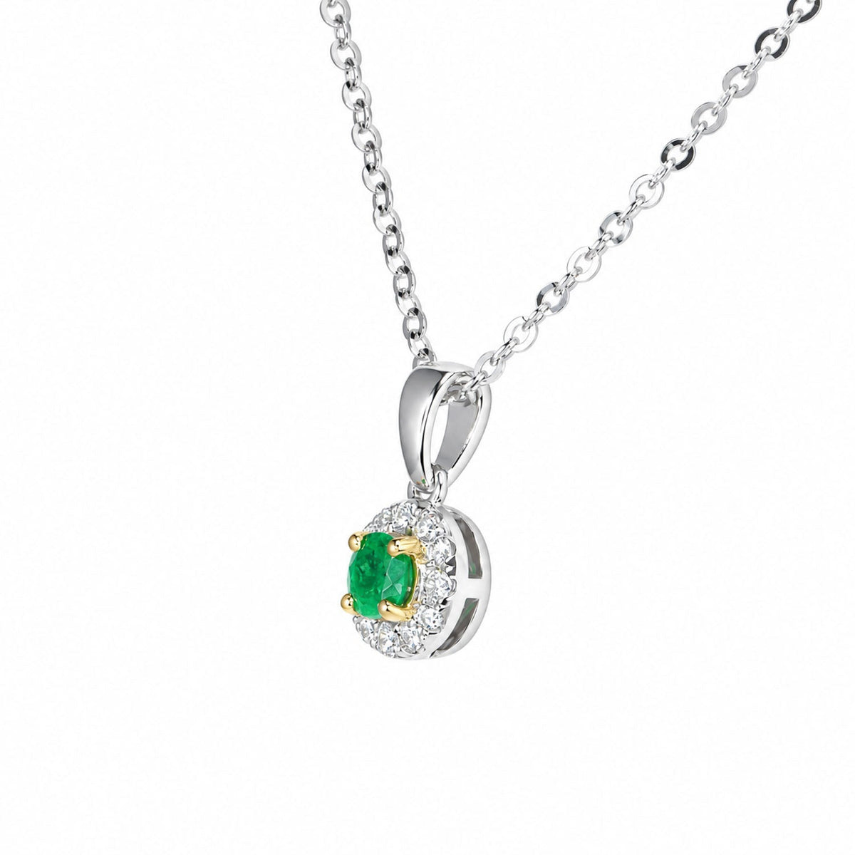 Close view of the Colombian emerald pendant and its diamond halo