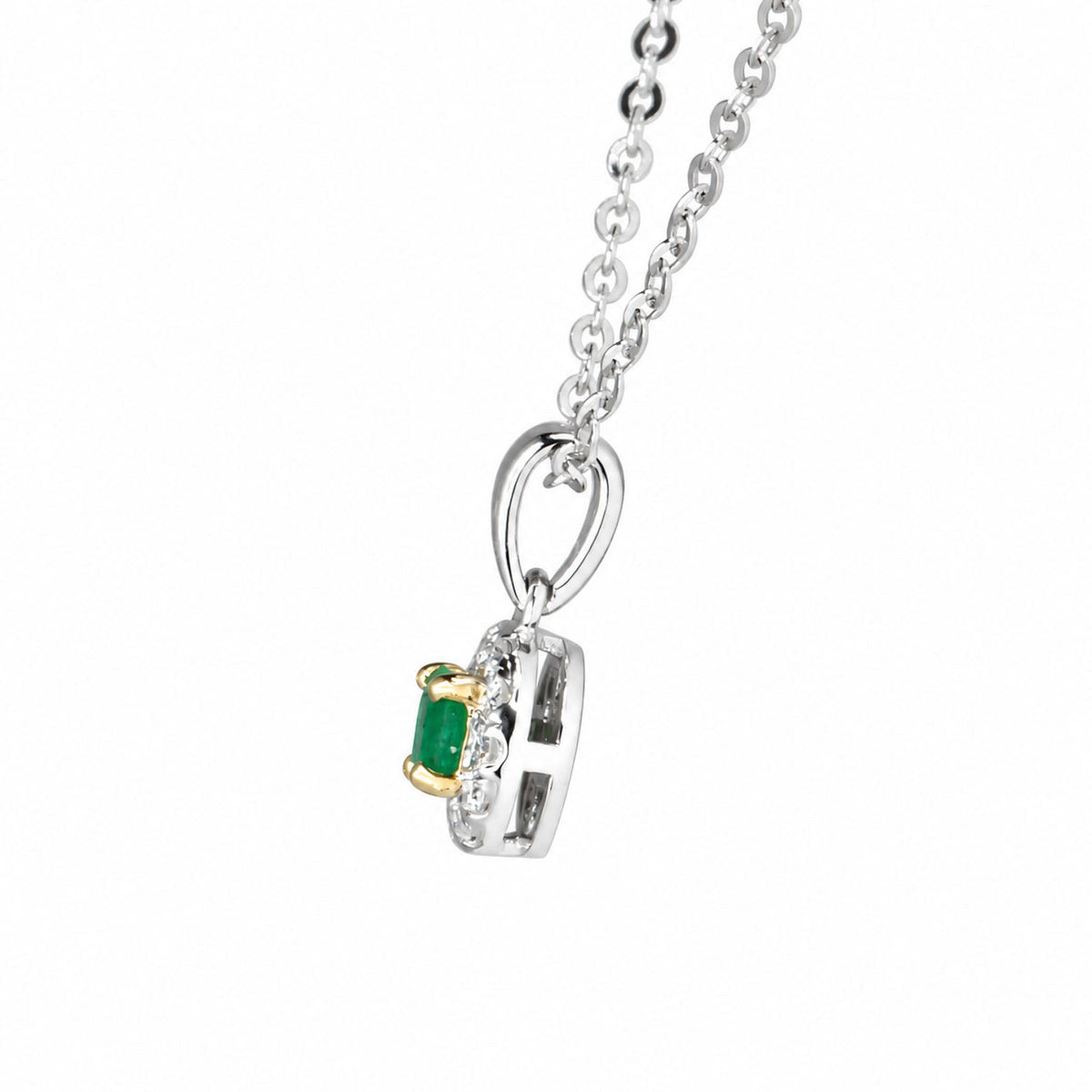 Side profile of the emerald halo pendant and its bail