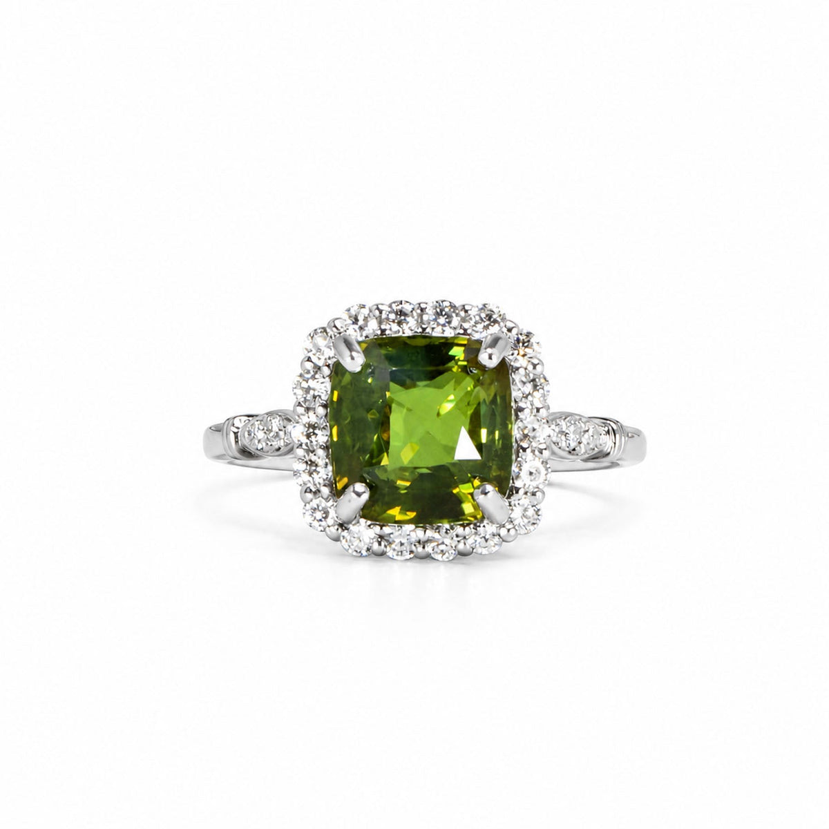 Cushion-cut alexandrite framed by a diamond halo in platinum