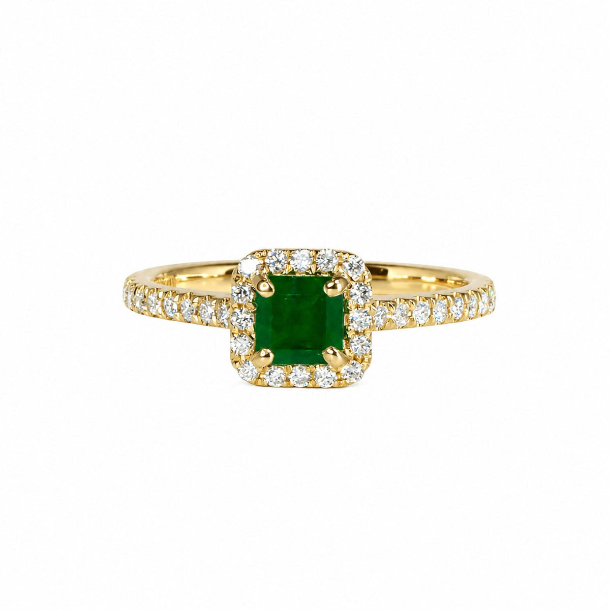 Colombian emerald and diamond halo ring in yellow gold