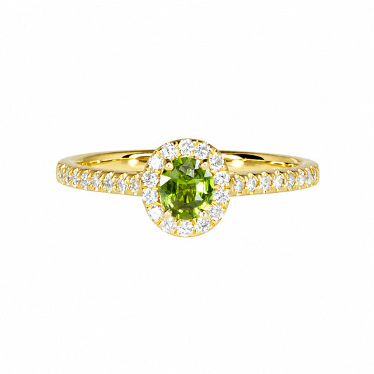 Alexandrite and diamond halo ring in 18K gold, green in daylight