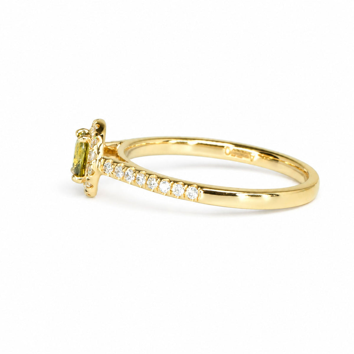 Side profile of the alexandrite halo ring with its pave-set band