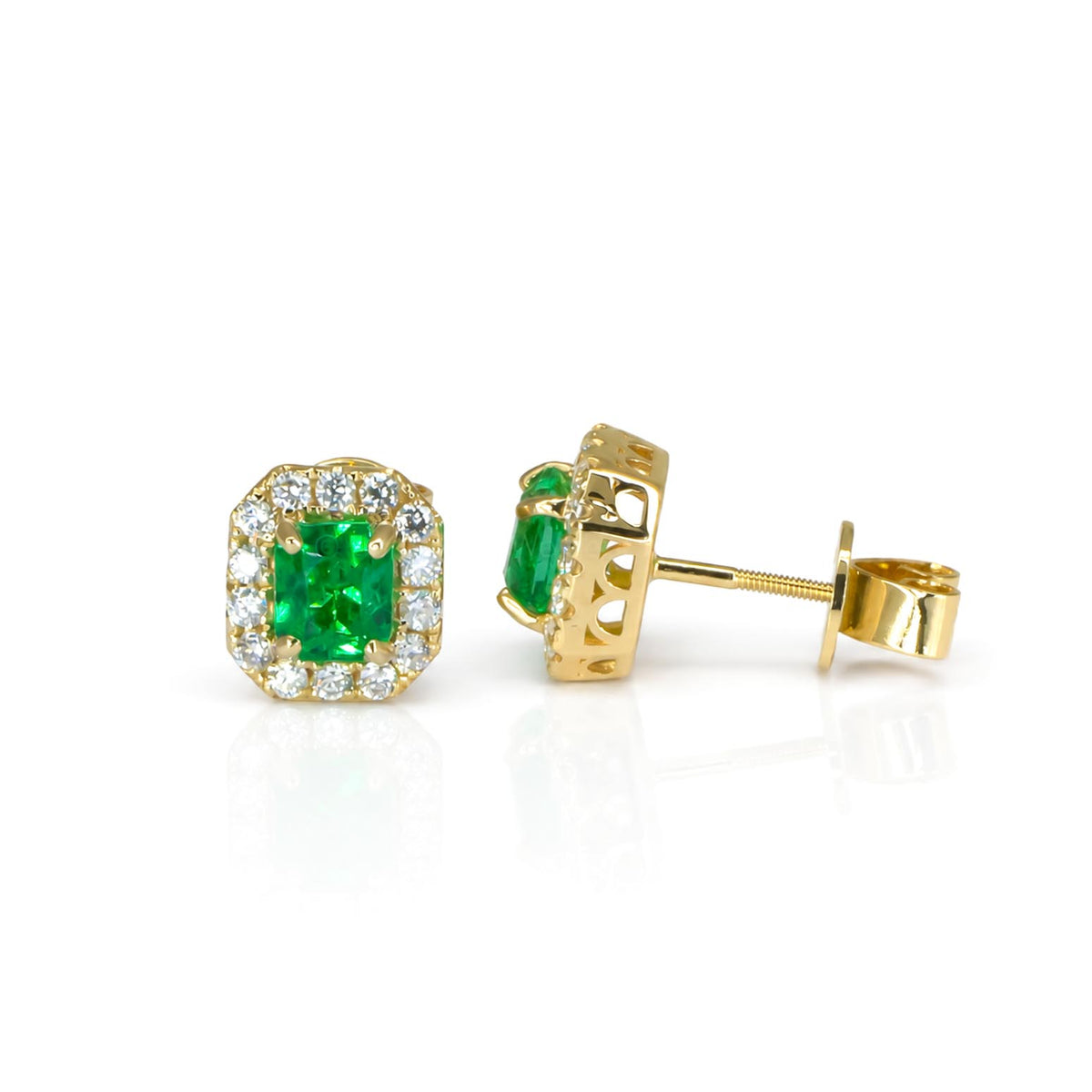 A pair of gold earrings contrasting their front and side view, featuring Colombian emeralds, a halo of diamonds and screw back closure in a white background