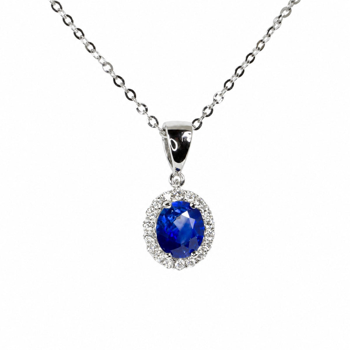 1.59 ct natural blue sapphire and diamond halo pendant in 18K white gold