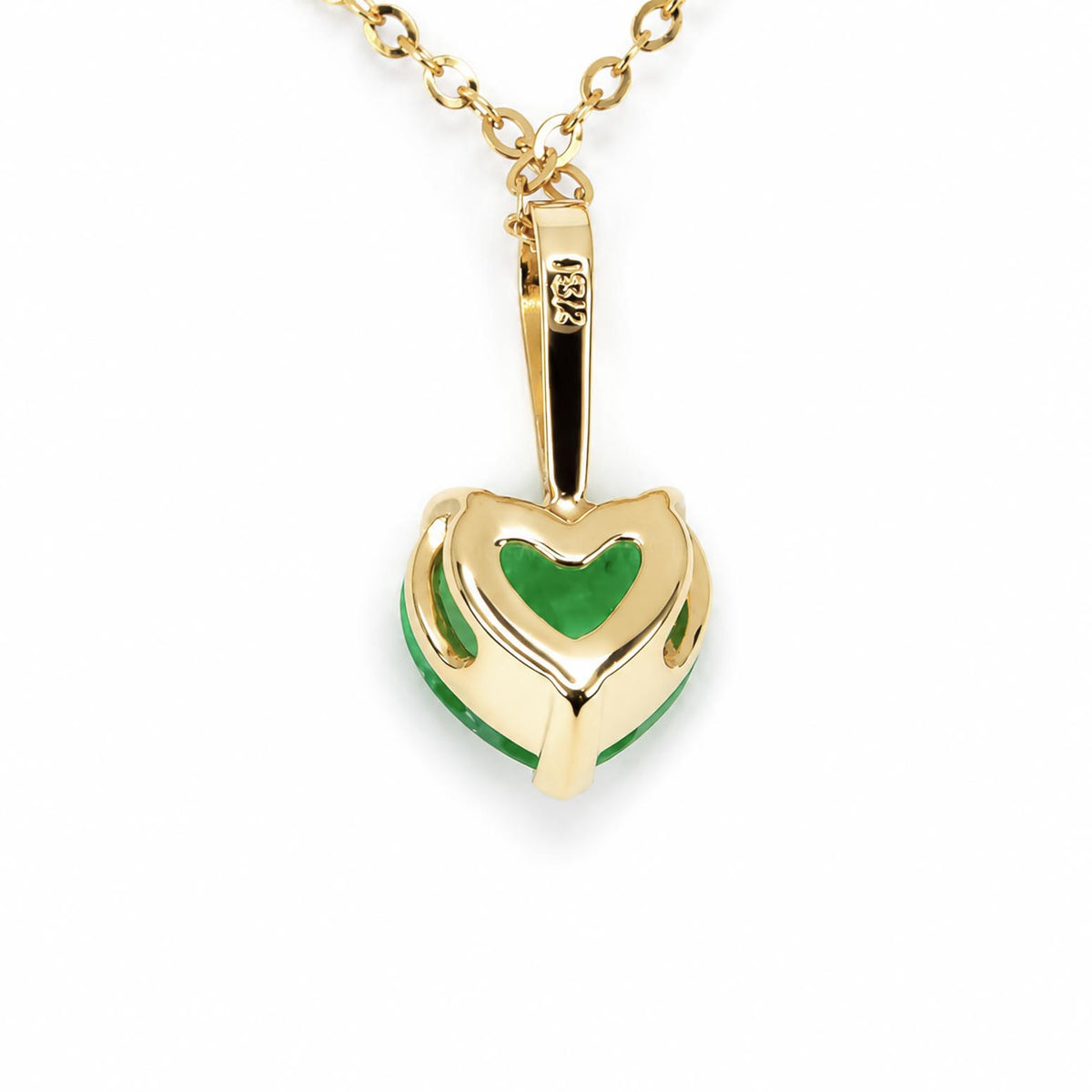 A back view of a gold heart-shaped pendant necklace with natural Colombian emerald, shown on a clean white background.