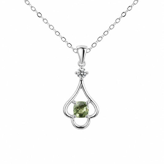 A white gold pendant necklace featuring a teardrop-shaped setting with a central green cushion-cut alexandrite and a small diamond accent above, suspended from a delicate silver chain on a white background.