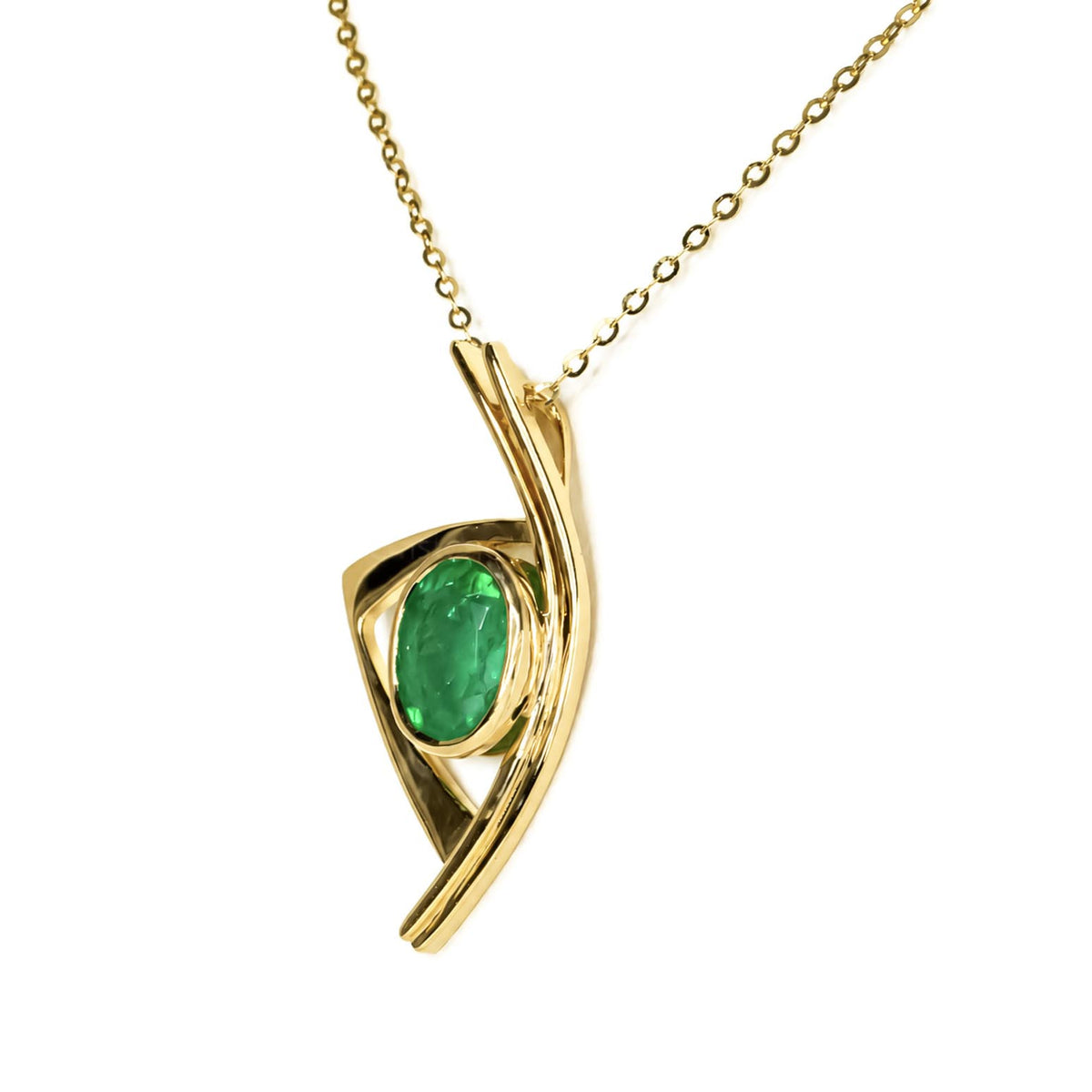 A gold pendant necklace featuring a twisted, abstract openwork design with a bezel-set oval Natural Colombian emerald, suspended from a delicate gold chain against a solid white background.