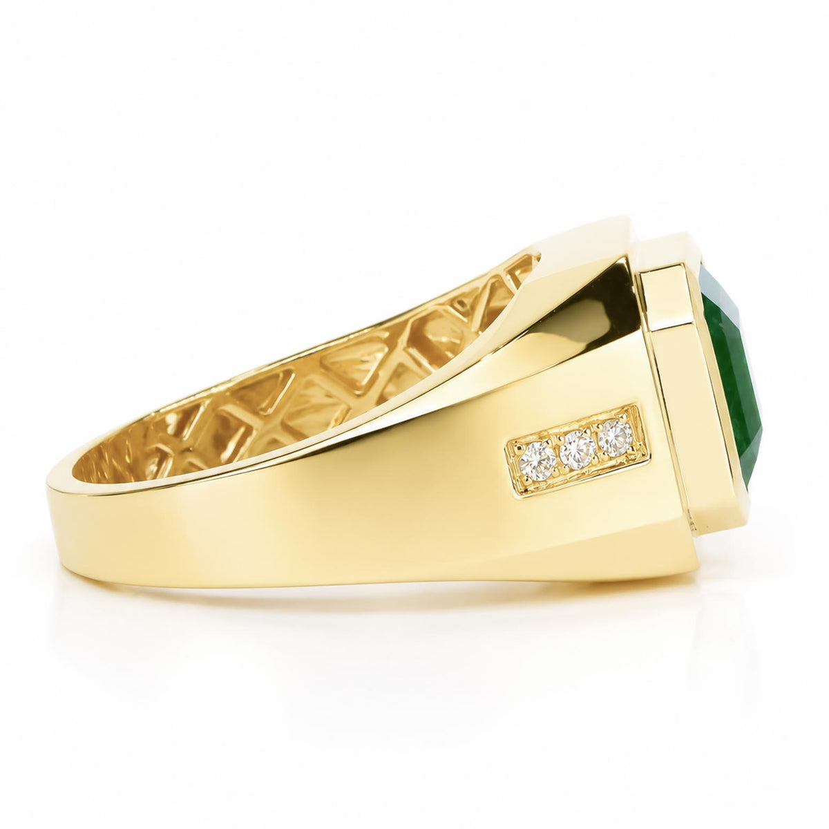 Side view of a men's ring featuring an emerald cut Colombian emerald and side accent round-brilliant cut diamonds on a thick gold band