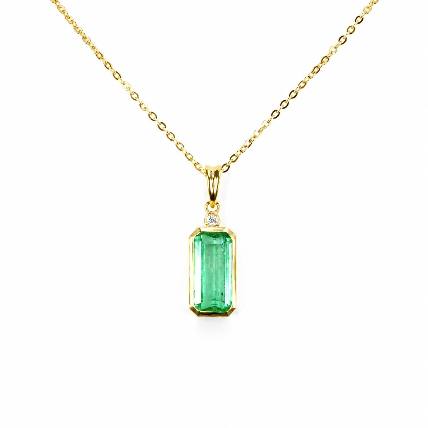 2.70 carat natural Colombian emerald cut pendant in 18K yellow gold with diamond accent