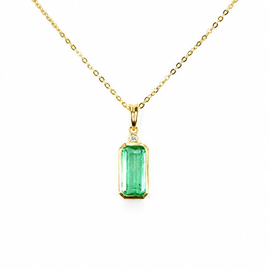 2.70 carat natural Colombian emerald cut pendant in 18K yellow gold with diamond accent