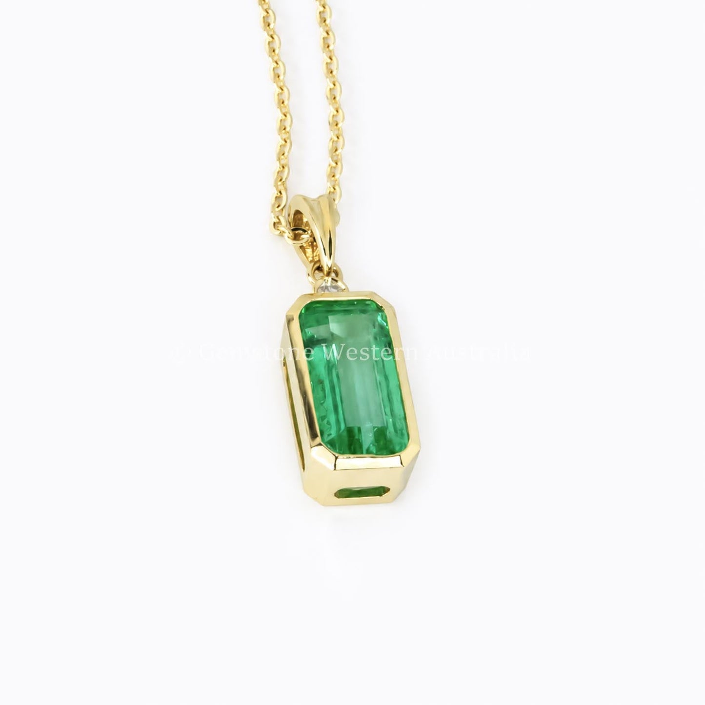 Colombian emerald pendant necklace in 18K yellow gold with diamond bail
