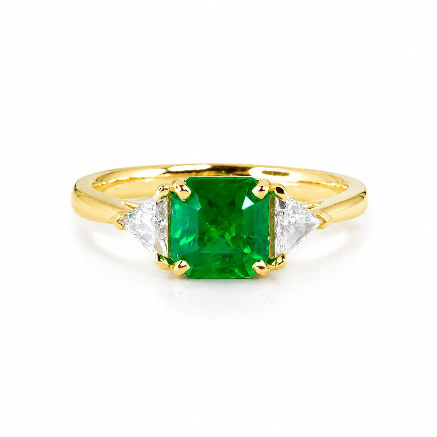 1.19 carat natural Colombian emerald cut ring with trillion diamond accents in 18K yellow gold