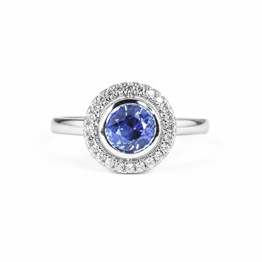 Natural blue sapphire ring with floating diamond halo in platinum 950