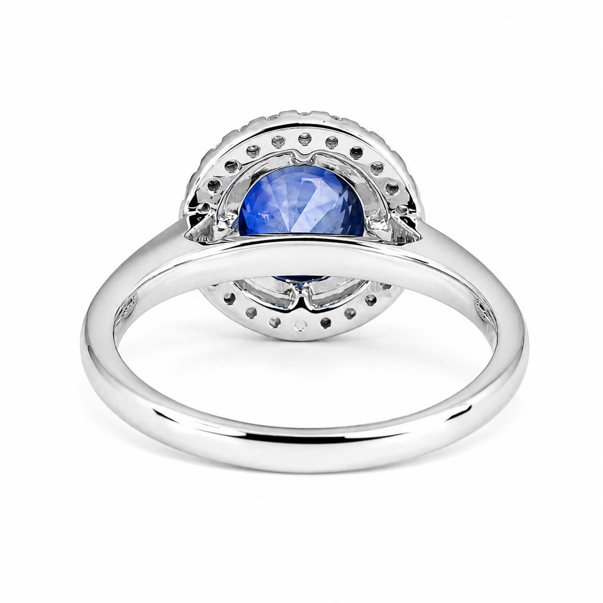 Side view of blue sapphire floating halo ring in platinum