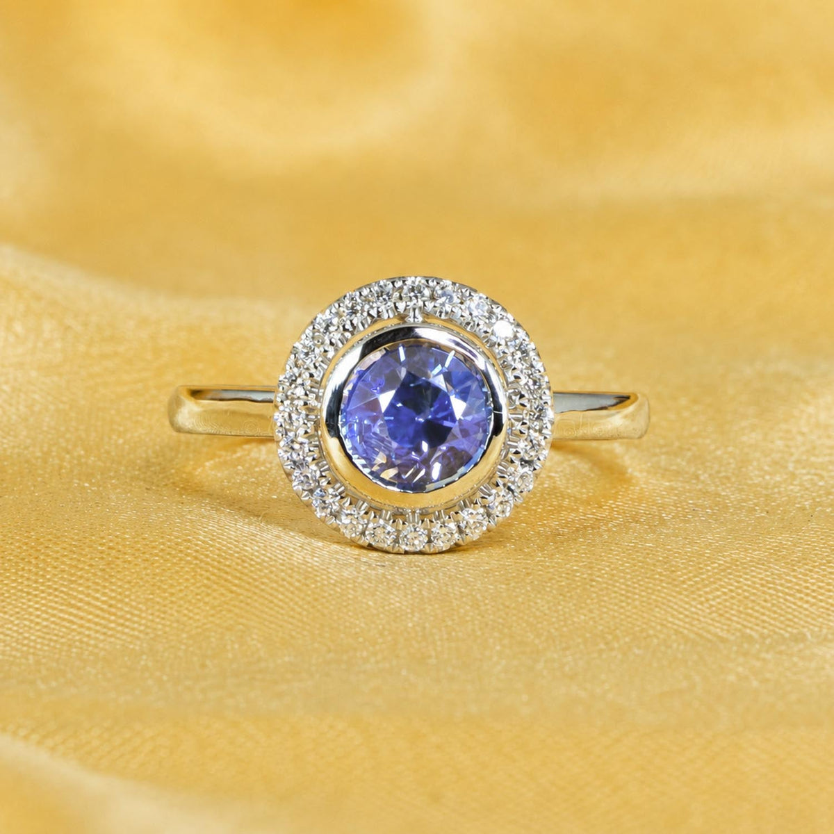 Blue sapphire and diamond ring in platinum on display