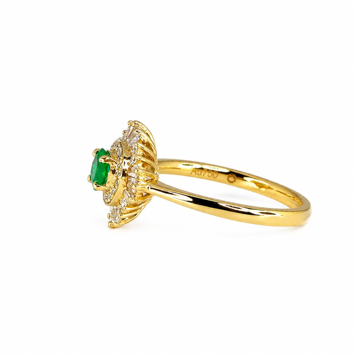 Round Colombian emerald ring with baguette and round diamond accents