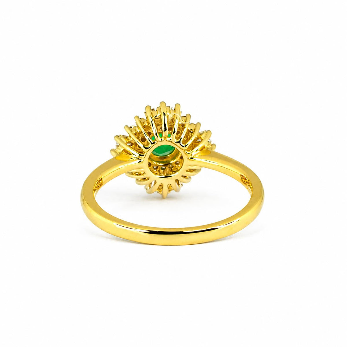 Side view of art deco emerald and diamond ring in 18K yellow gold