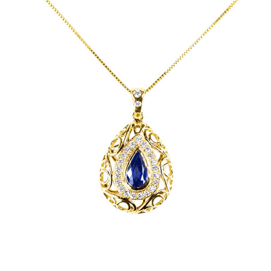 Natural blue sapphire pendant with diamond halo in 18K yellow gold