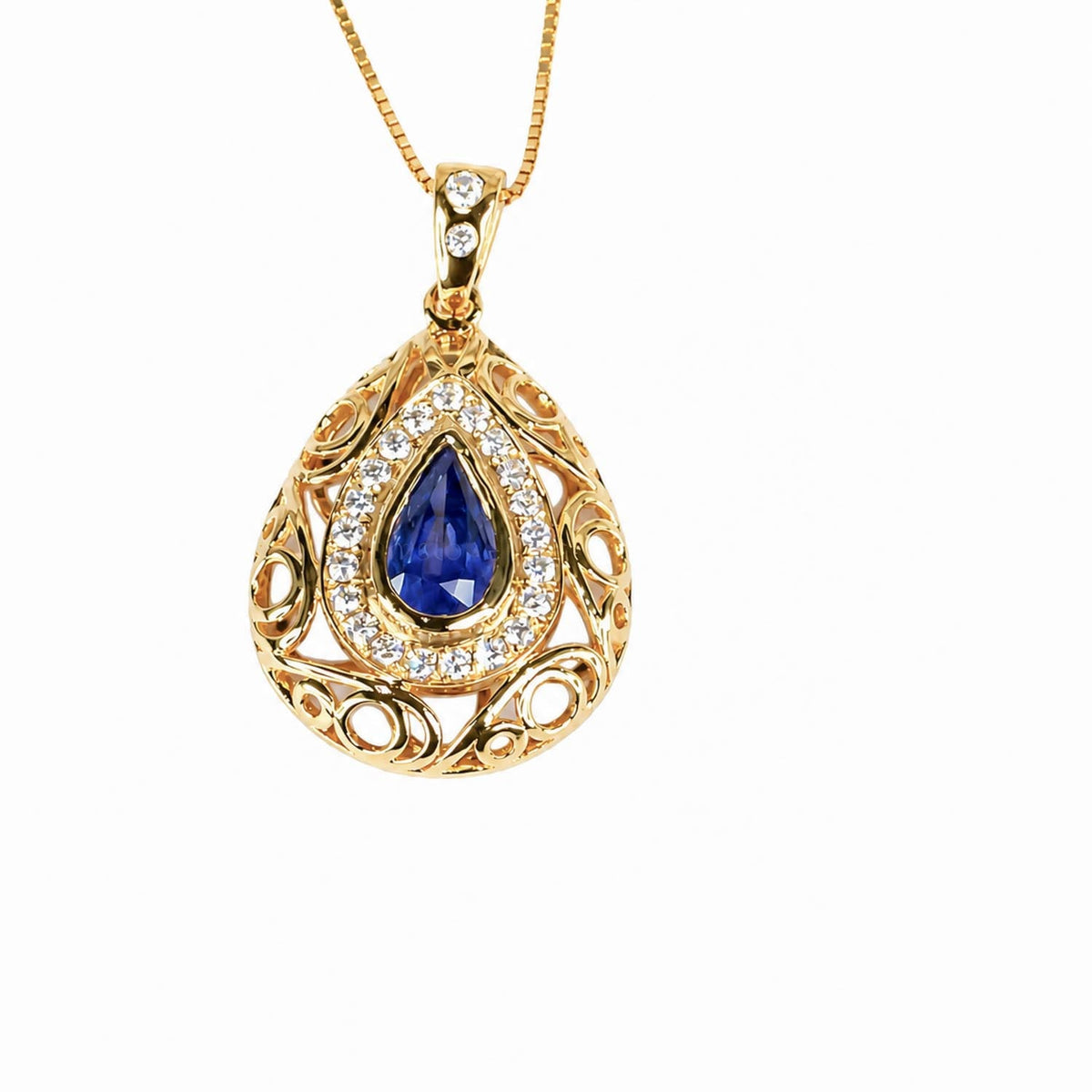 Pear cut blue sapphire pendant in dome-style diamond halo setting