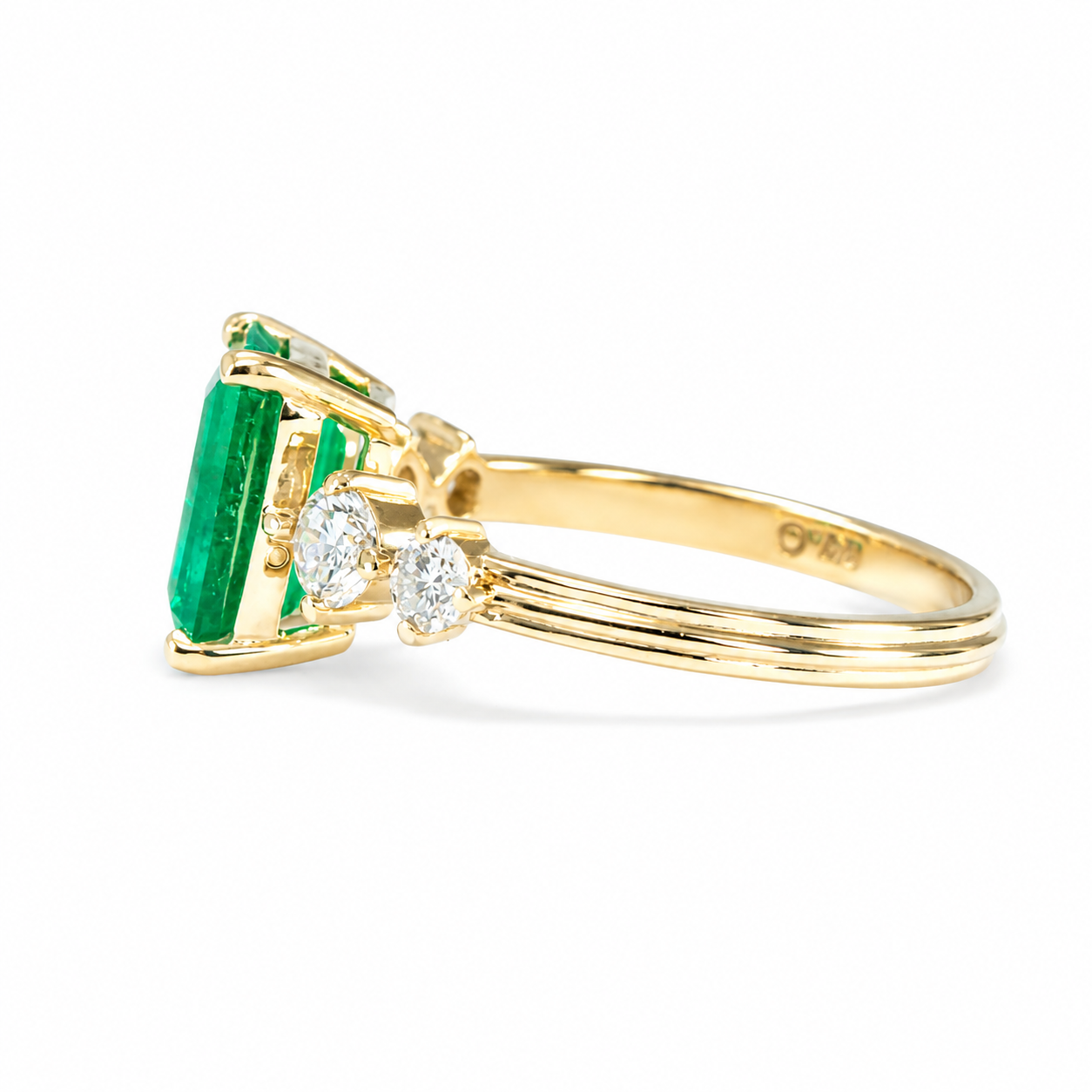 side view of 2.29ct Natural Colombian Emerald Ring with GIA Diamonds in white background 