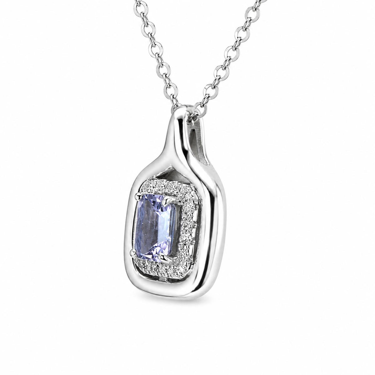 side view of a white gold pendant with a violet sapphire in the centre surrounded by diamonds and shown on a white background