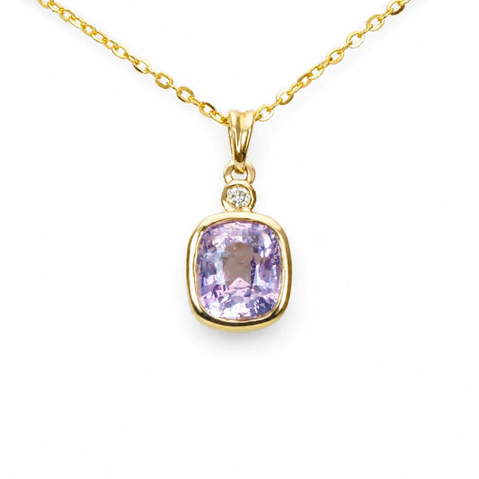 Soft pink sapphire pendant in 18K yellow gold with a 2.58ct cushion cut sapphire and diamond accent