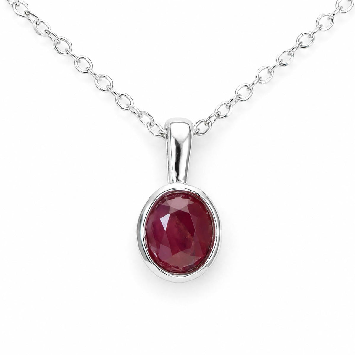 Unheated oval cut ruby pendant bezel set in platinum