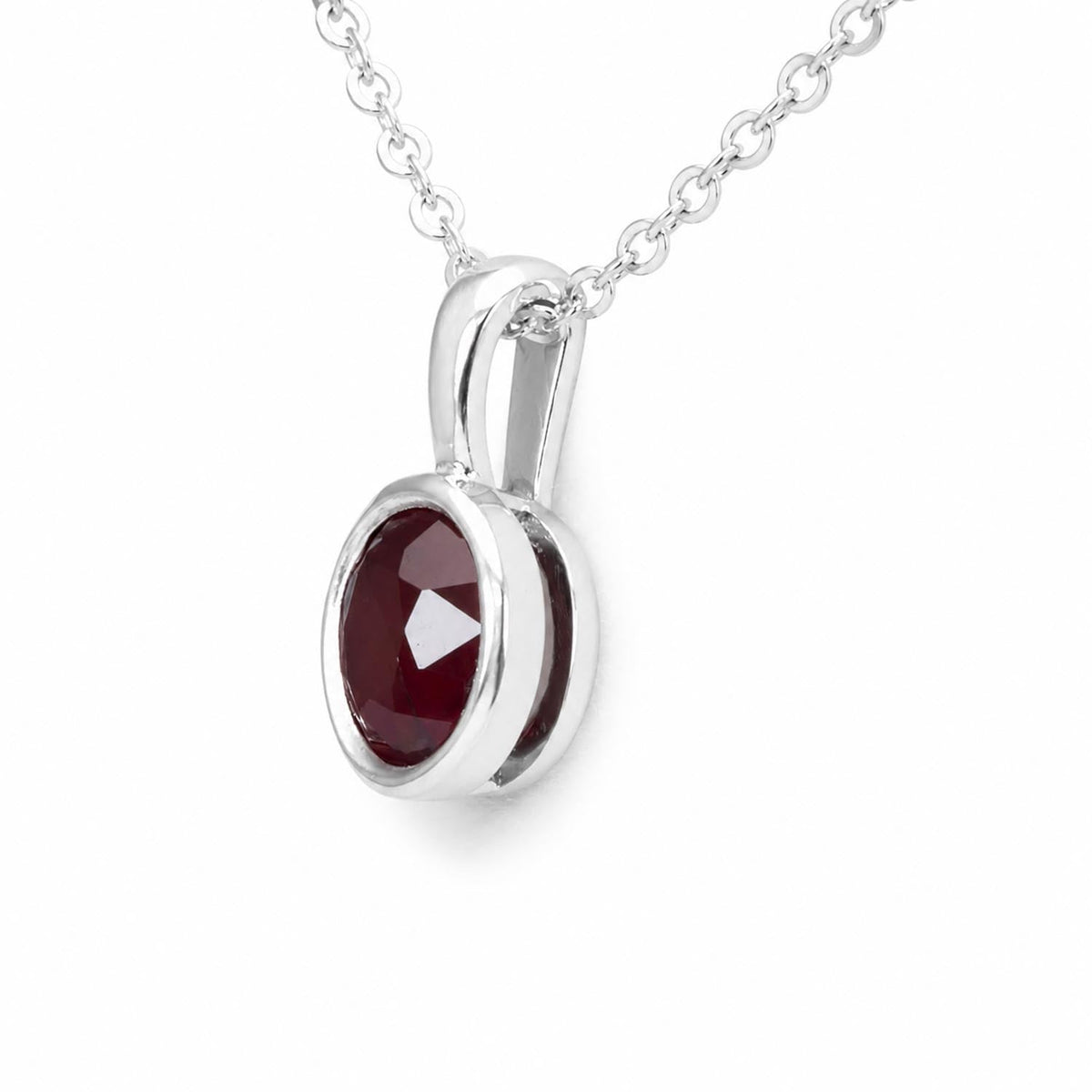 Bezel set natural unheated ruby pendant in platinum shown from the side