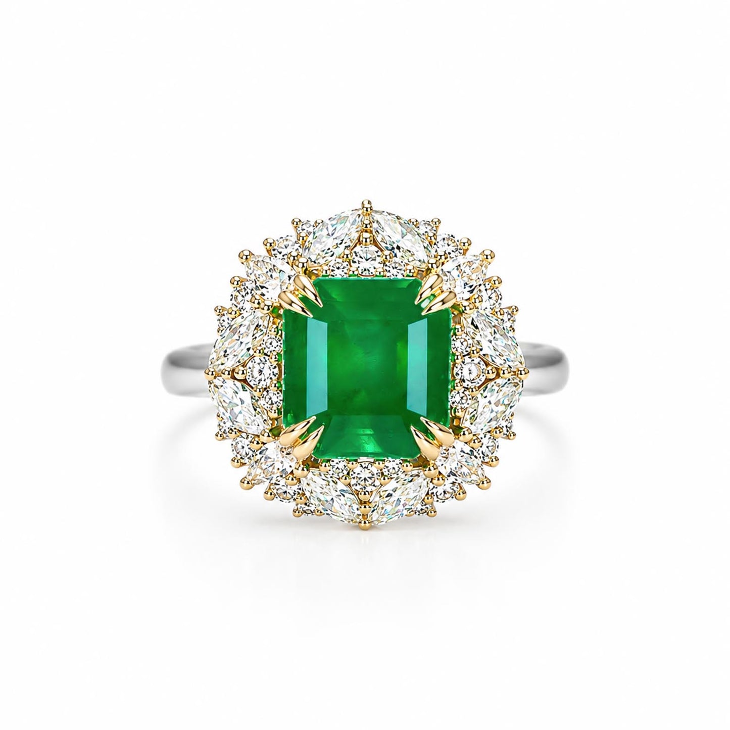 A halo ring featuring an emerald-cut Colombian emerald center stone surrounded by a double halo of round and marquise and pear-cut diamonds in yellow gold and white gold settings, shown on a clean white background.