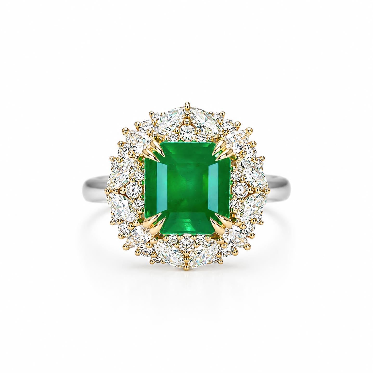 A halo ring featuring an emerald-cut Colombian emerald center stone surrounded by a double halo of round and marquise and pear-cut diamonds in yellow gold and white gold settings, shown on a clean white background.