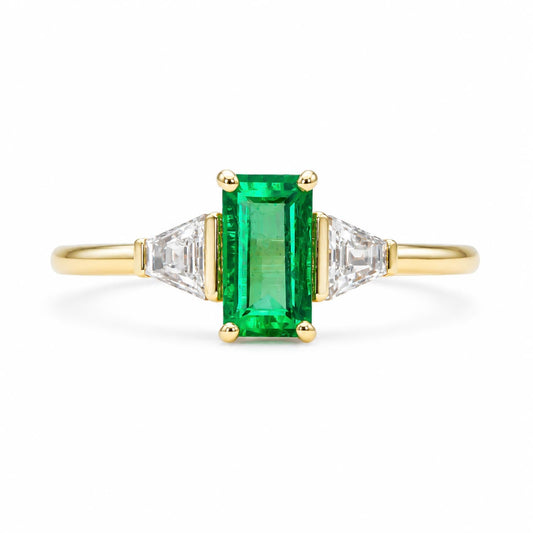 Side profile of the Colombian emerald three stone ring in 18K yellow gold