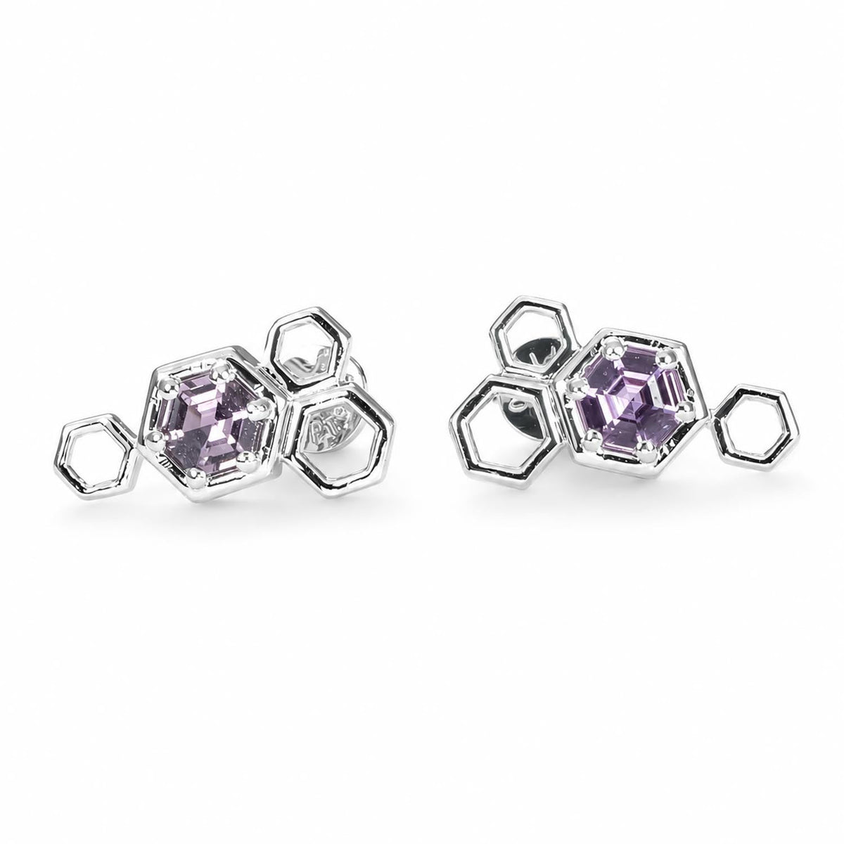 Honeycomb design pink sapphire earrings in platinum 950 shown at an angle