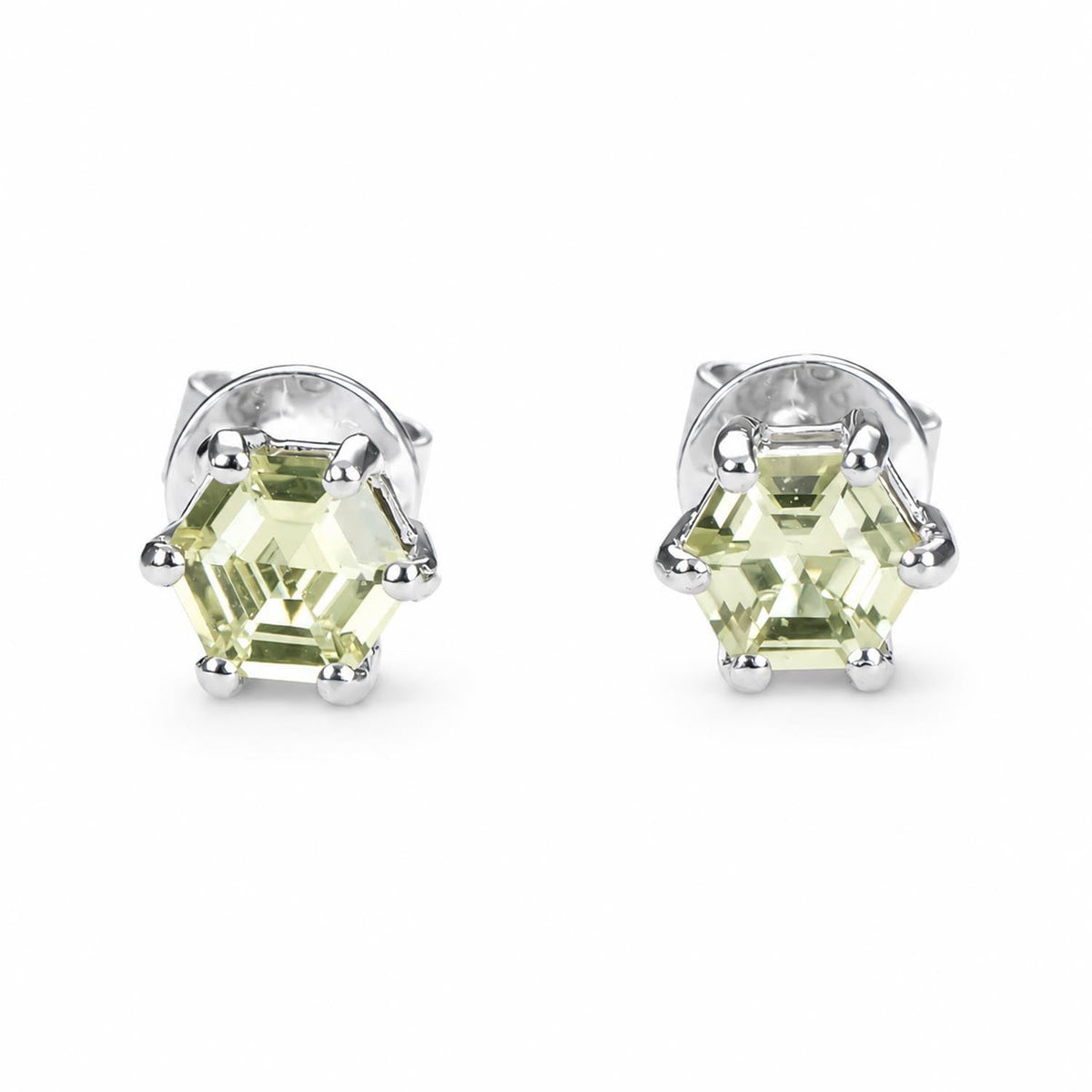 Lime green sapphire studs in platinum with 0.53ct hexagonal cut natural sapphires