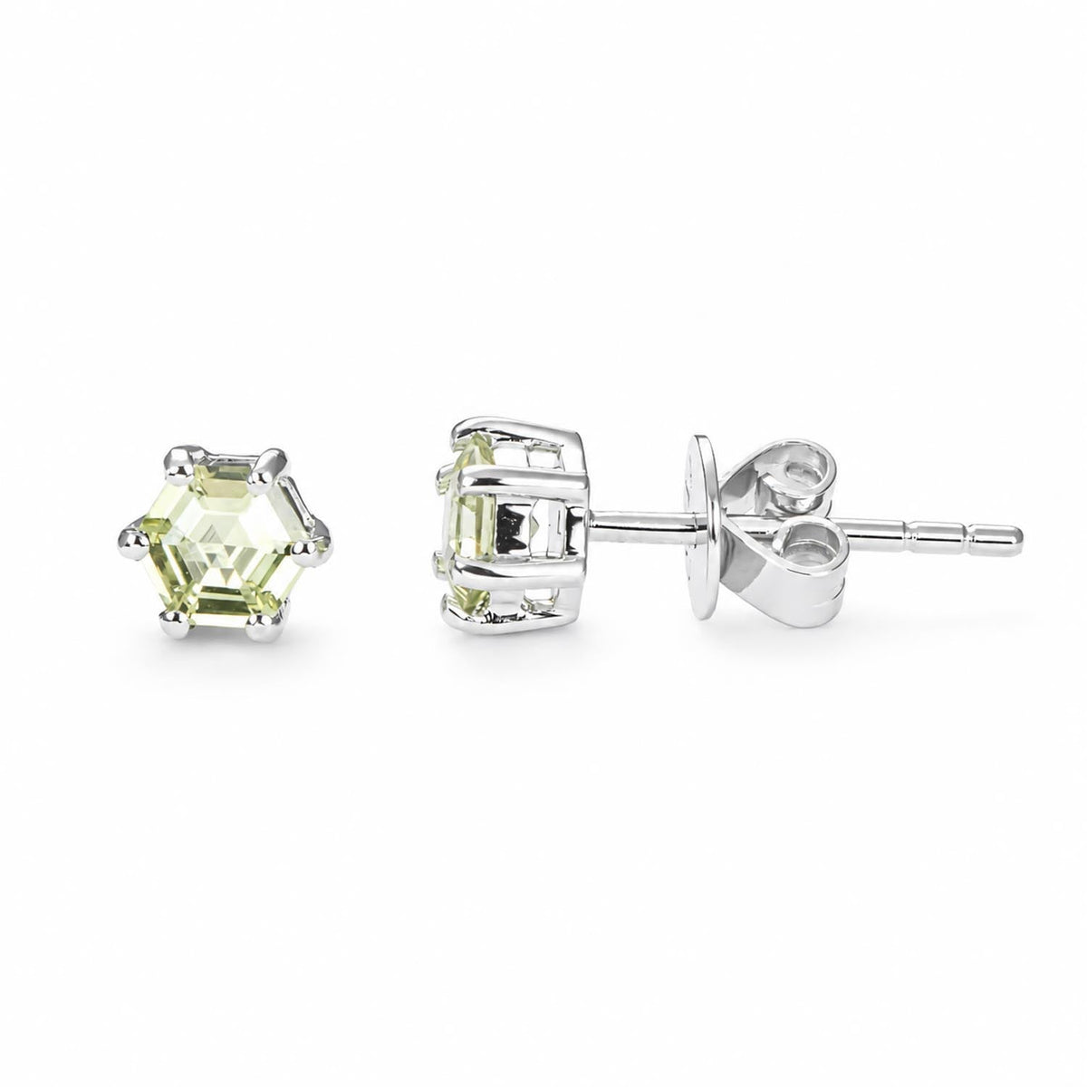 Hexagonal cut lime green sapphire studs in platinum 950 shown at an angle