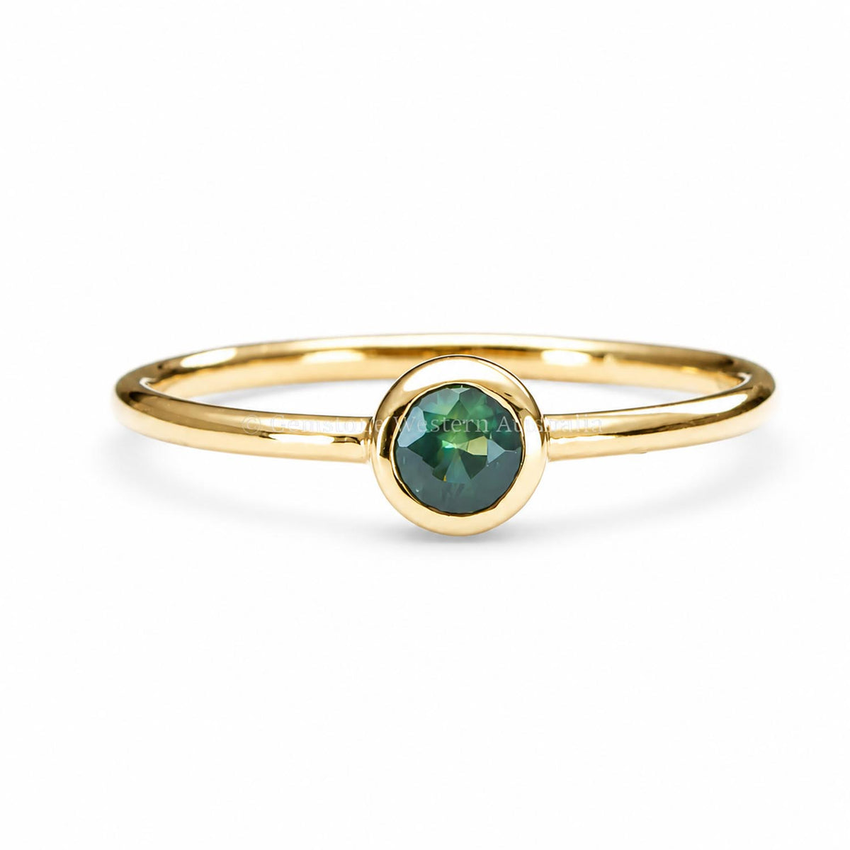 Australian sapphire yellow gold ring shown on a white background