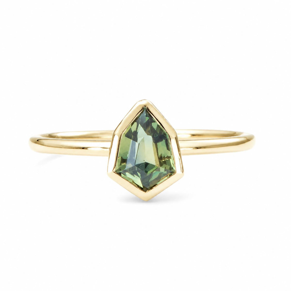Shield cut teal sapphire ring in 18K yellow gold with a 0.71ct natural sapphire