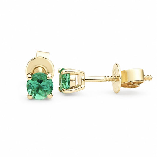 0.56ct Colombian emerald studs in 18K yellow gold shown at an angle