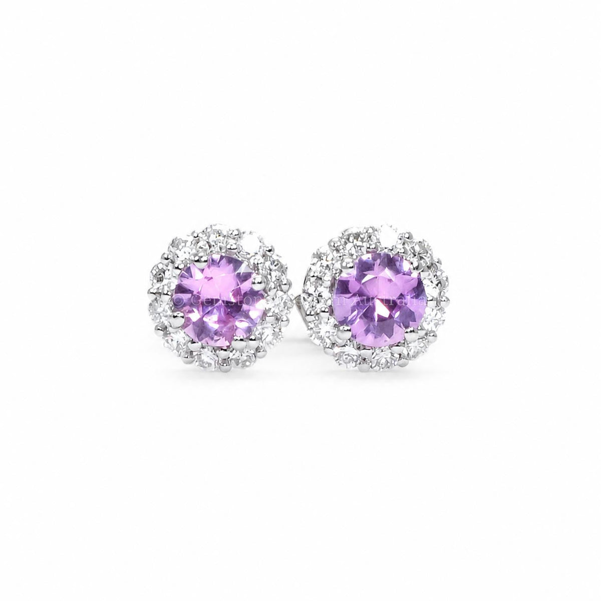 Natural pink sapphire stud earrings with a diamond halo