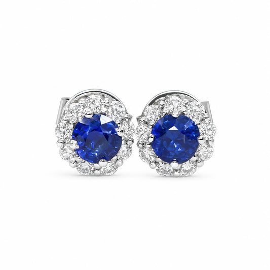 Natural blue sapphire stud earrings with a diamond halo in 18K yellow gold