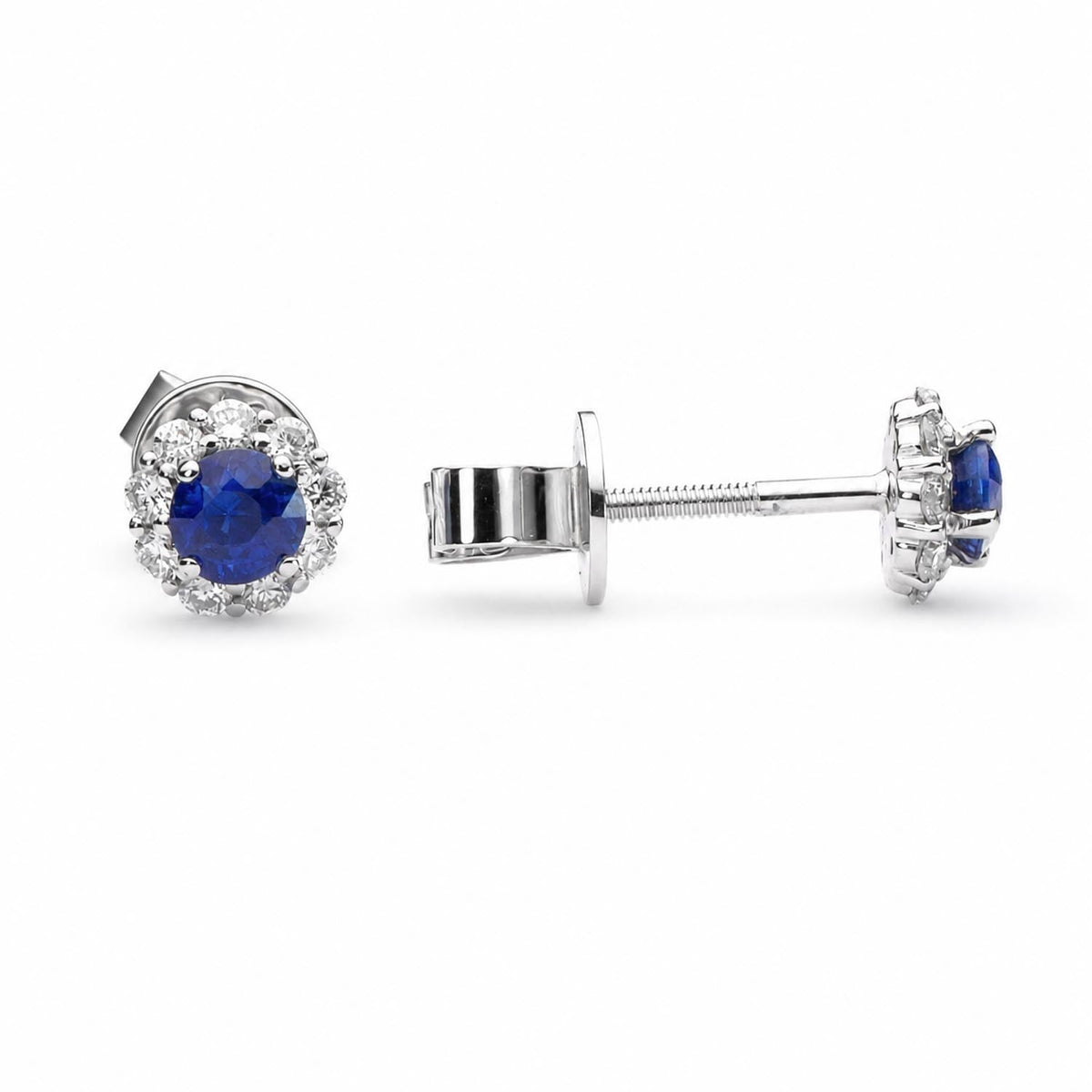 Blue sapphire diamond halo studs in 18K yellow gold shown at an angle