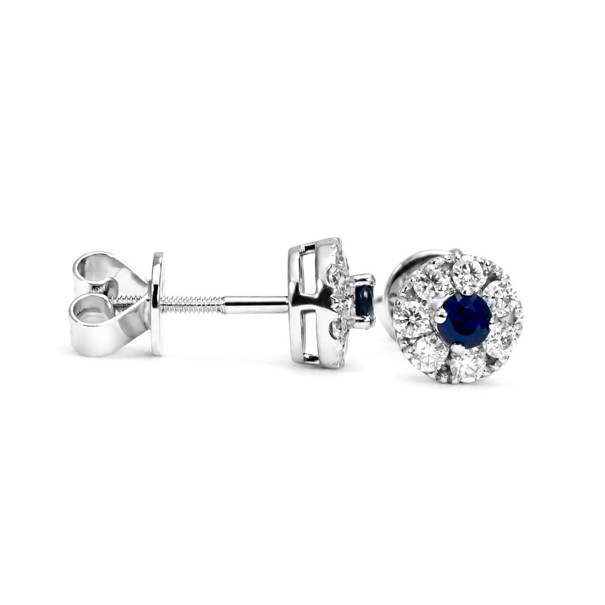 A pair of white gold stud earrings featuring a central round-cut blue sapphire surrounded by a halo of moissanites, with the post and butterfly back shown on a white background.