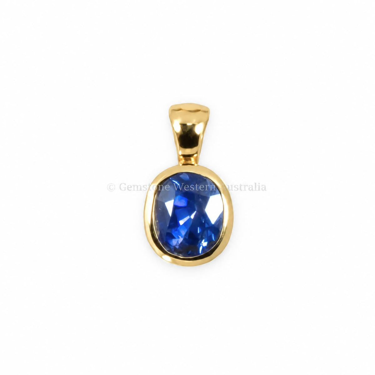 1.20ct cornflower blue sapphire pendant in 18K yellow gold shown at an angle