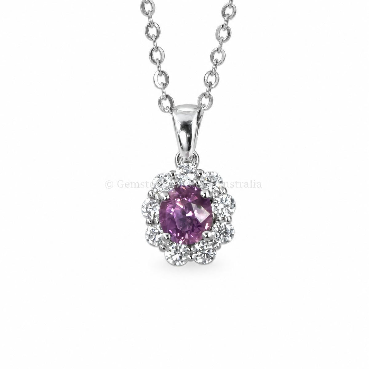Natural pink sapphire pendant with a moissanite halo in platinum 950